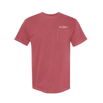 Front view of crimson Born & Raised 2025 pocket t-shirt with small festival logo on chest