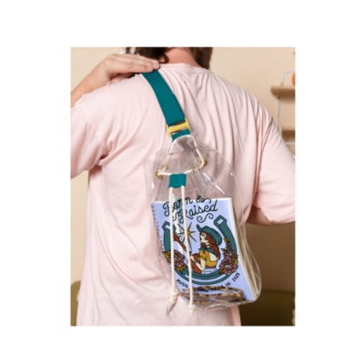 Born & Raised Music Festival clear vinyl sling bag with cowgirl artwork and teal strap